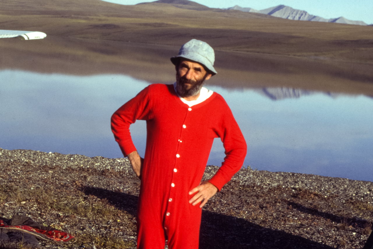 Lenny Kohm in red thermal underwear in front of lake.